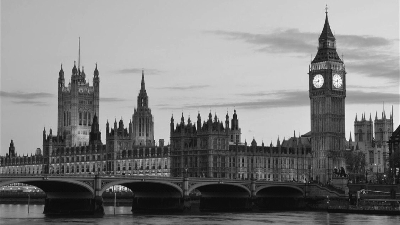 The Palace of Westminster and Big Ben above the Thames at dusk