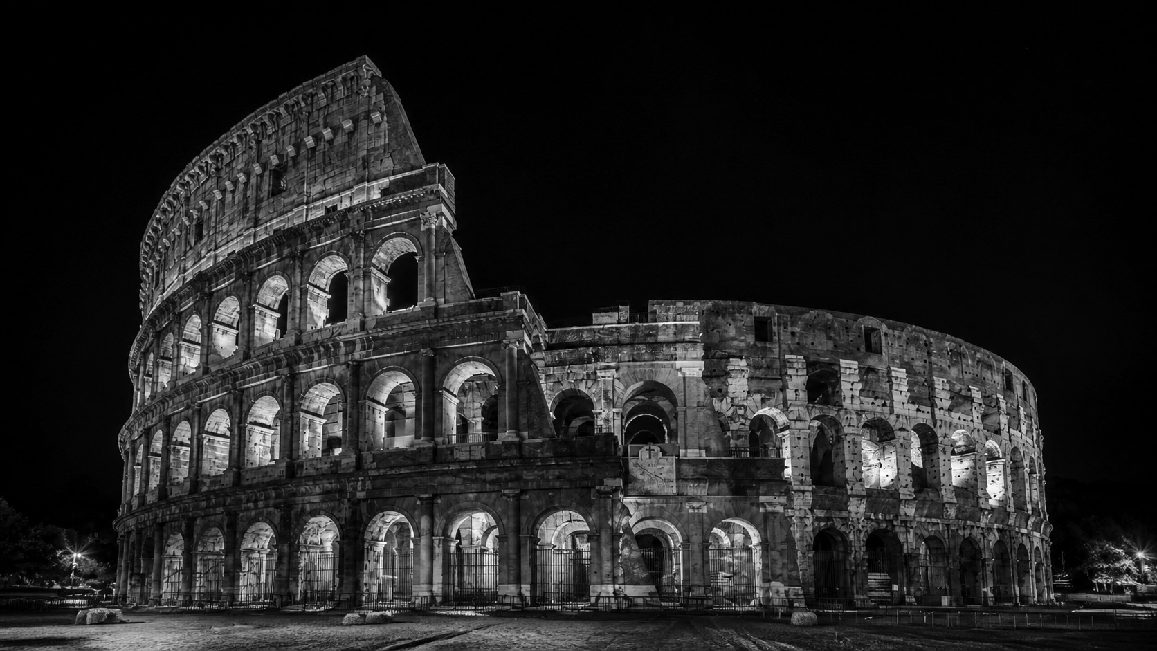 The Colosseum in Rome at night, black and white photograph